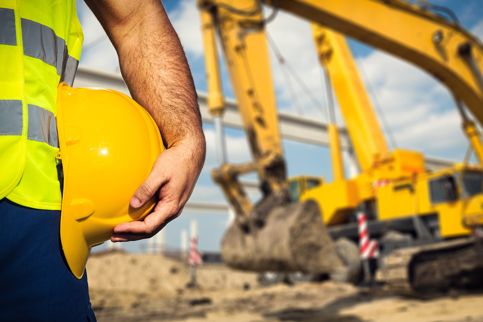 A worker holding his helmet